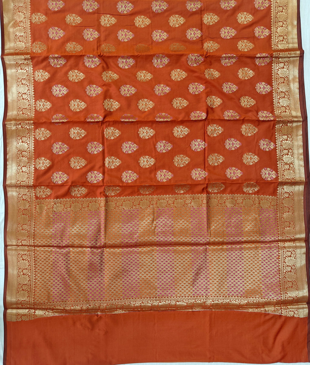 Banarasi katan by katan silk saree in orange colour with multiple meenakari work