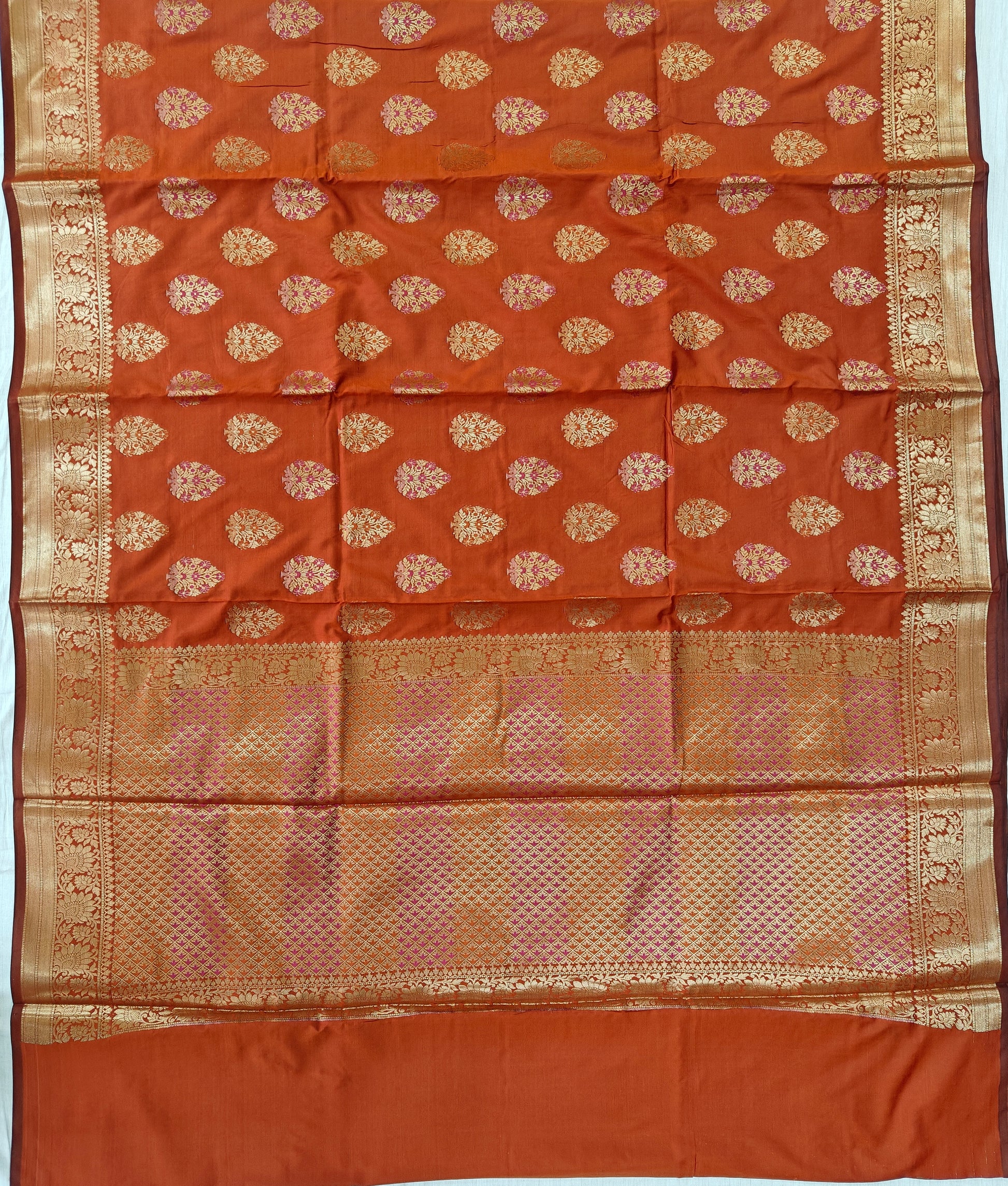Banarasi katan by katan silk saree in orange colour with multiple meenakari work