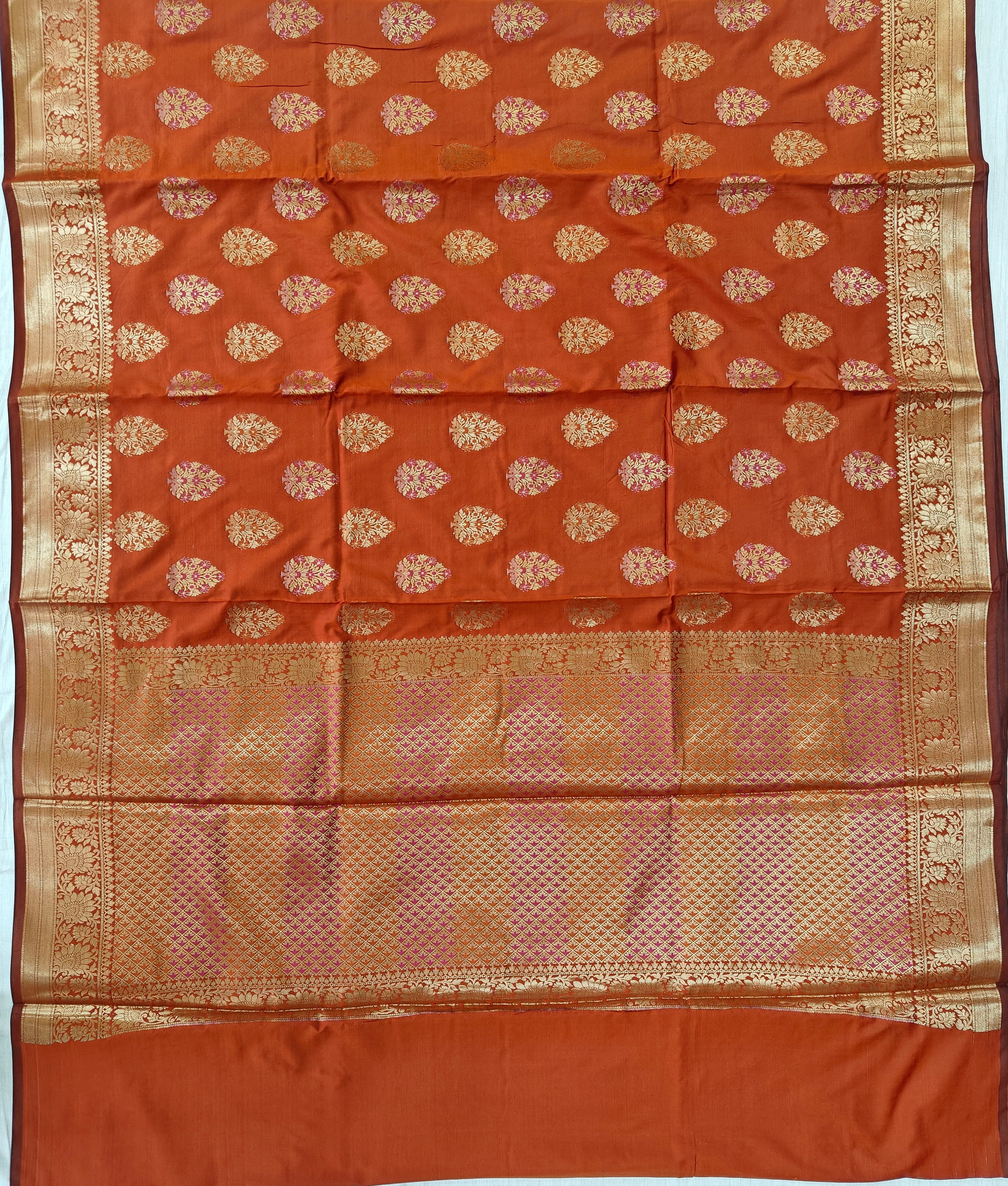 Banarasi katan by katan silk saree in orange colour with multiple meenakari work