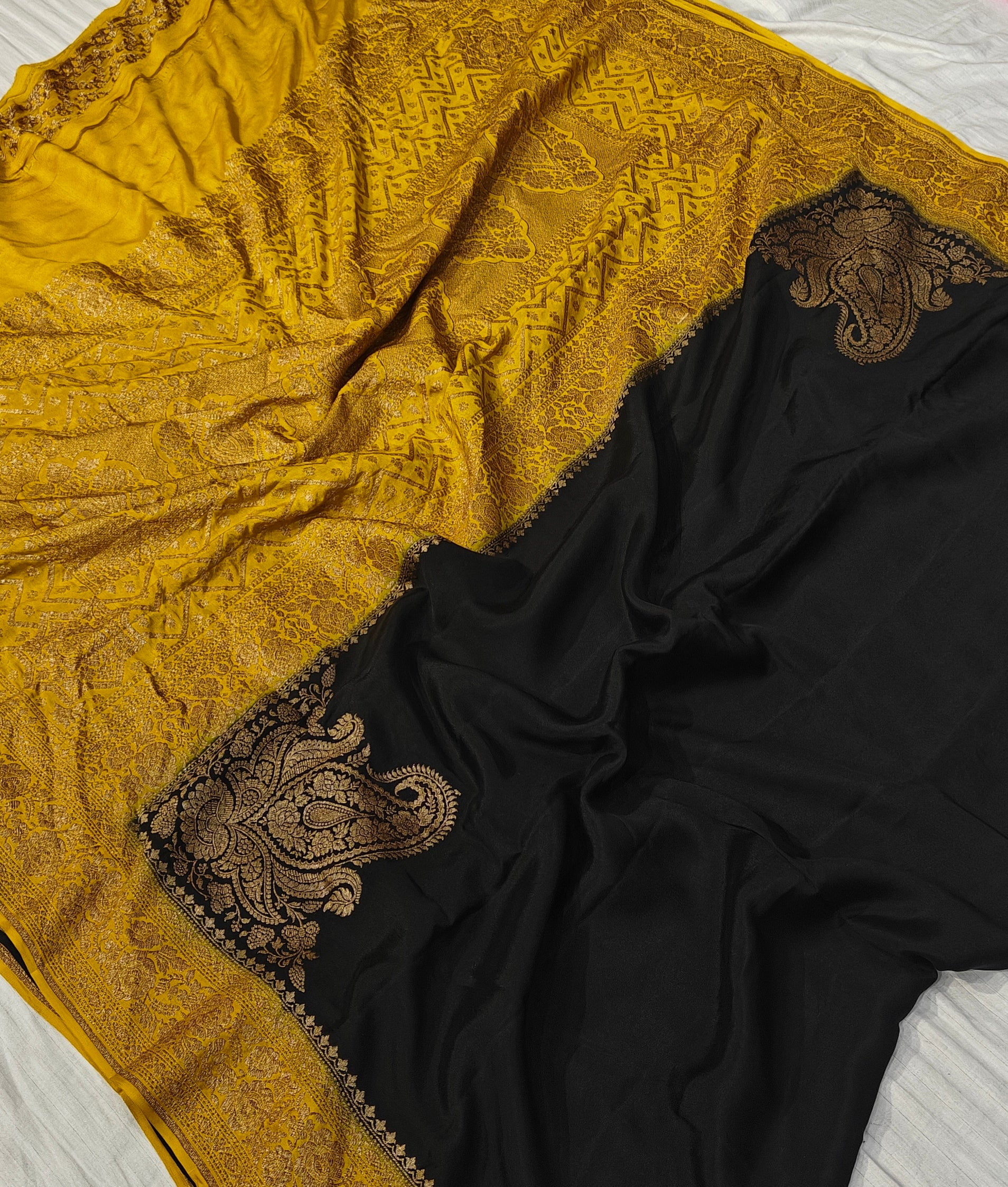 Pure khaddi crepe silk saree in black and mustard colour combination with pure antic zari work