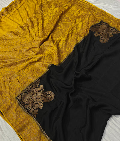 Pure khaddi crepe silk saree in black and mustard colour combination with pure antic zari work