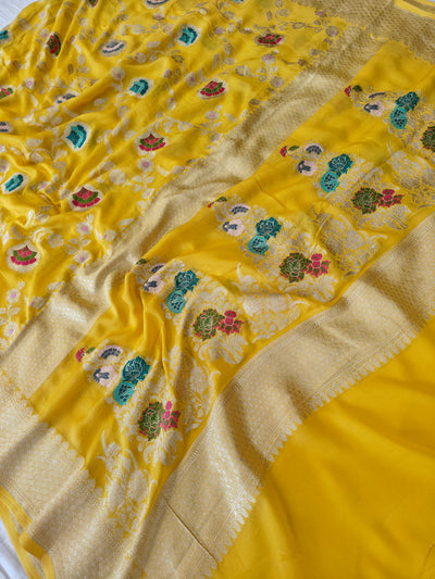 Premium pure georgette banarasi saree in yellow colour with multiple meenakari work