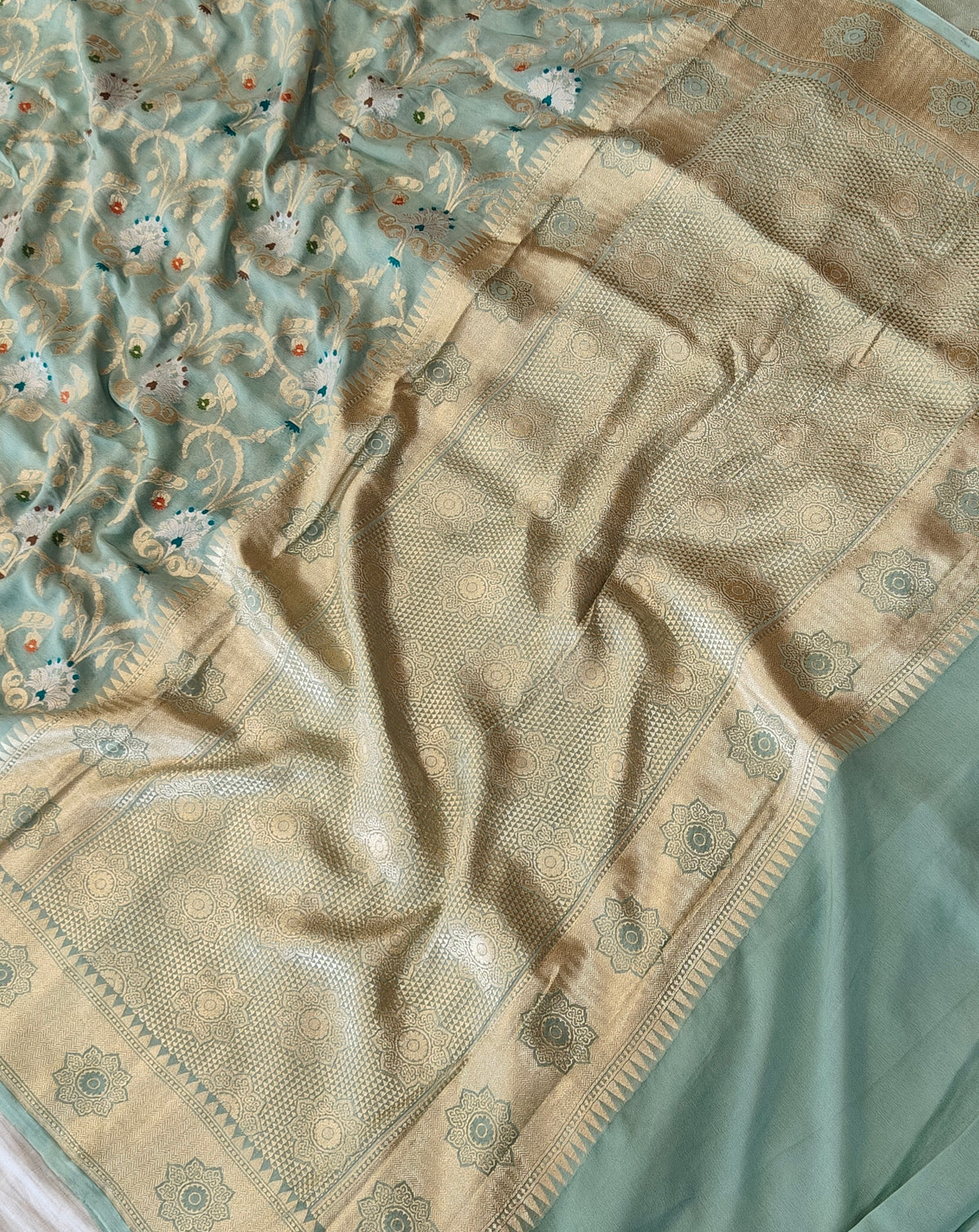 Premium pure georgette banarasi saree in sea green colour with multiple meenakari work