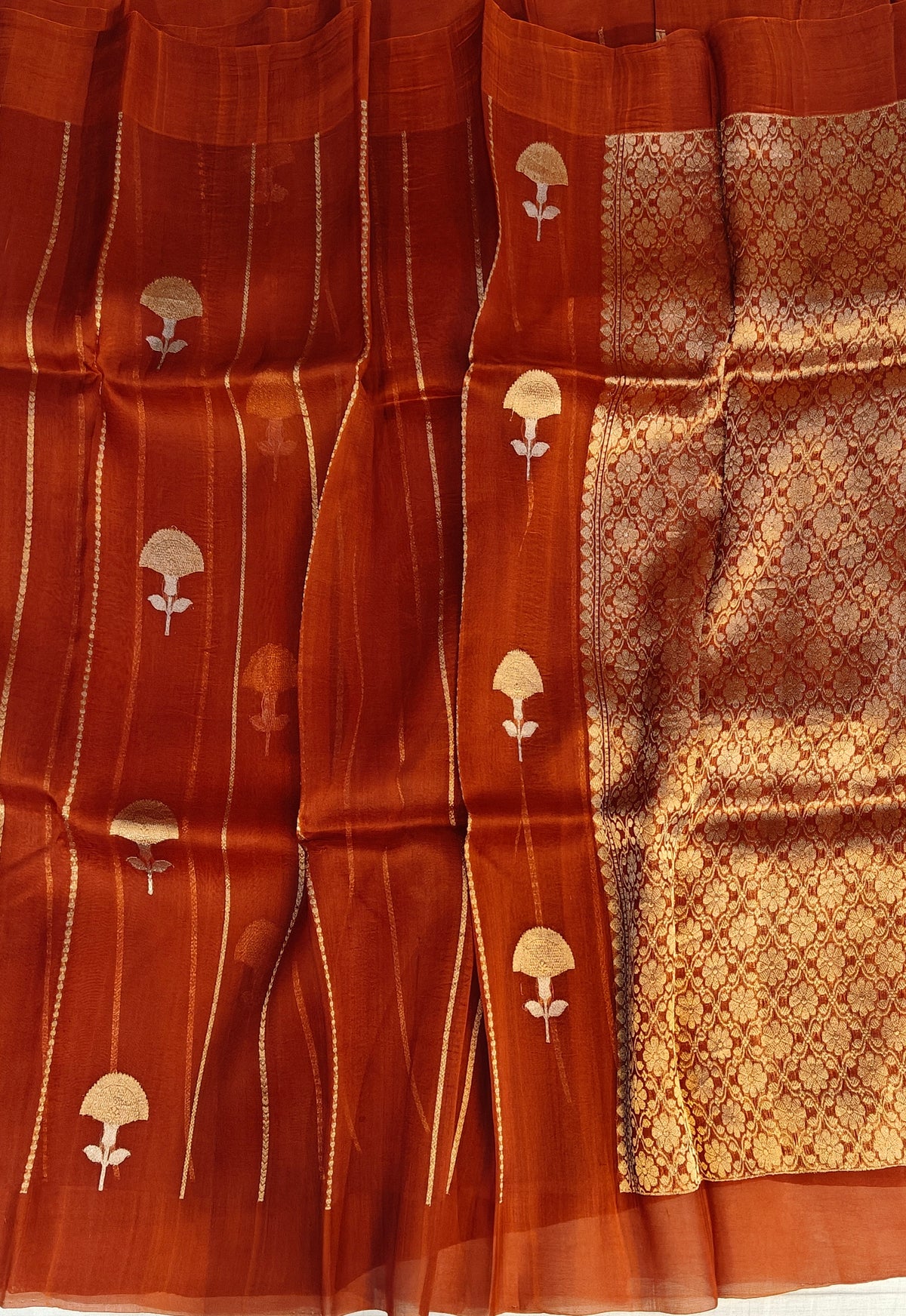 Pure handloom kora silk saree in stripes design with meenakari work in rust orange colour