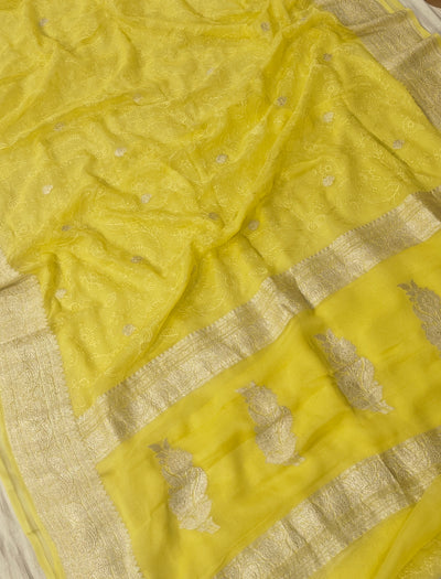 Pure khaddi chiffon saree in lemon yellow colour with all over chickenkari work