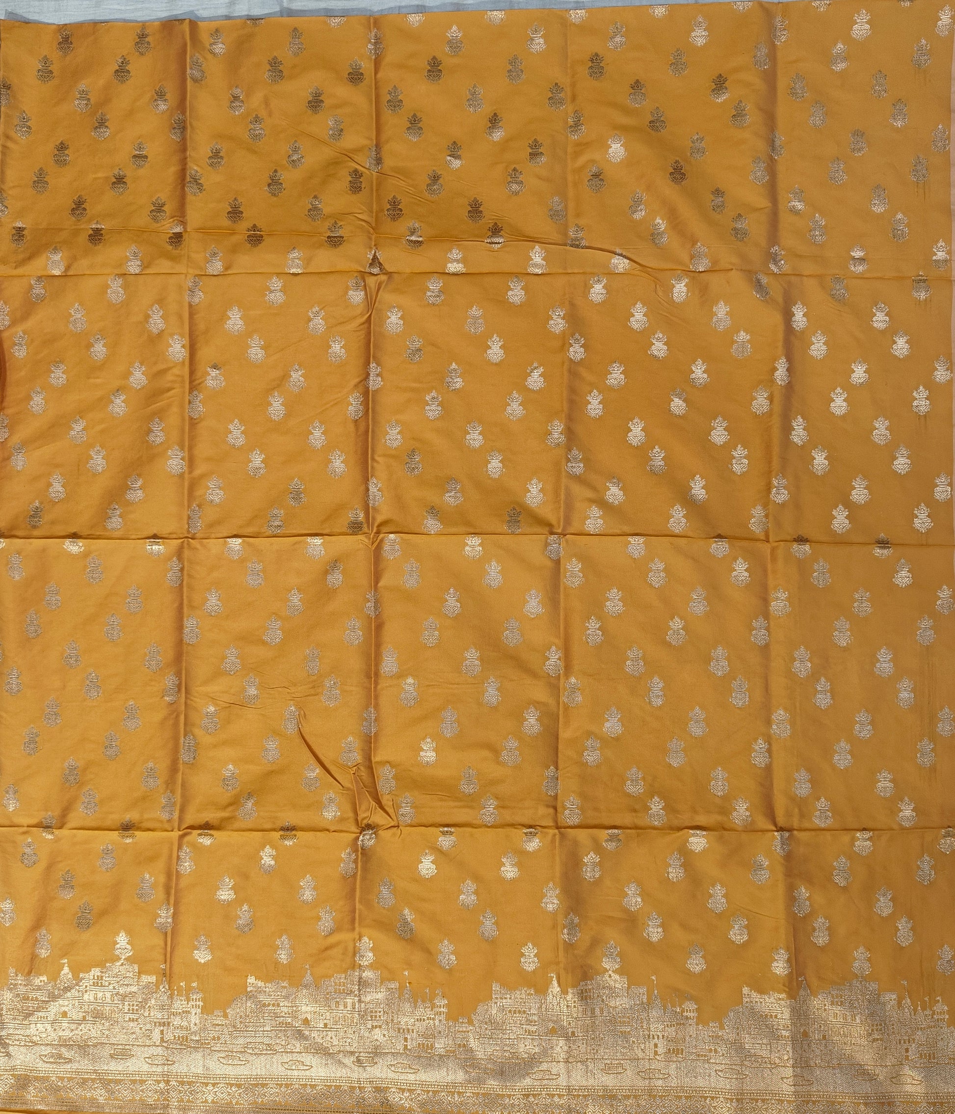 Banarasi soft silk suit in yellow colour with temple design work