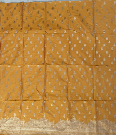 Banarasi soft silk suit in yellow colour with temple design work