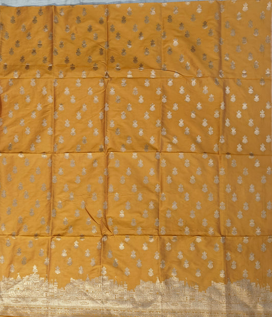 Banarasi soft silk suit in yellow colour with temple design work