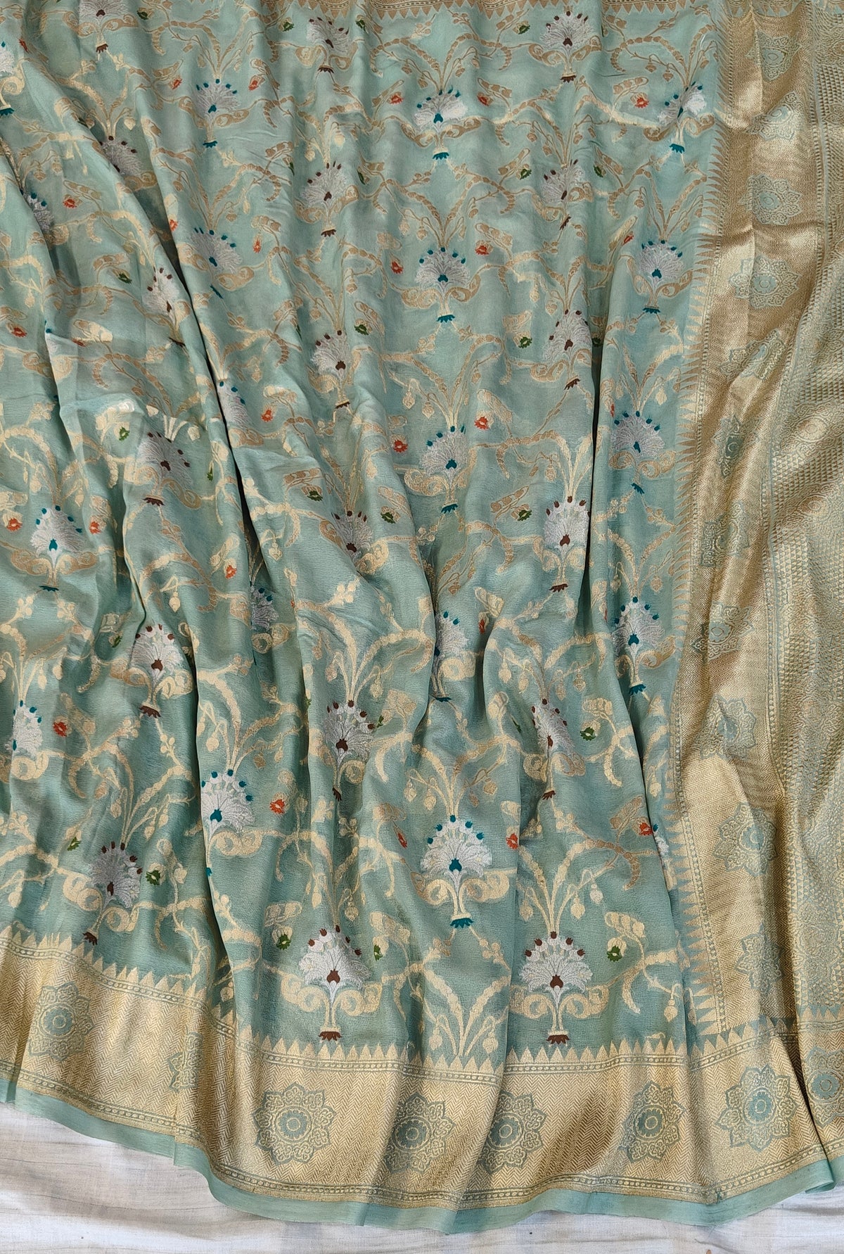Premium pure georgette banarasi saree in sea green colour with multiple meenakari work
