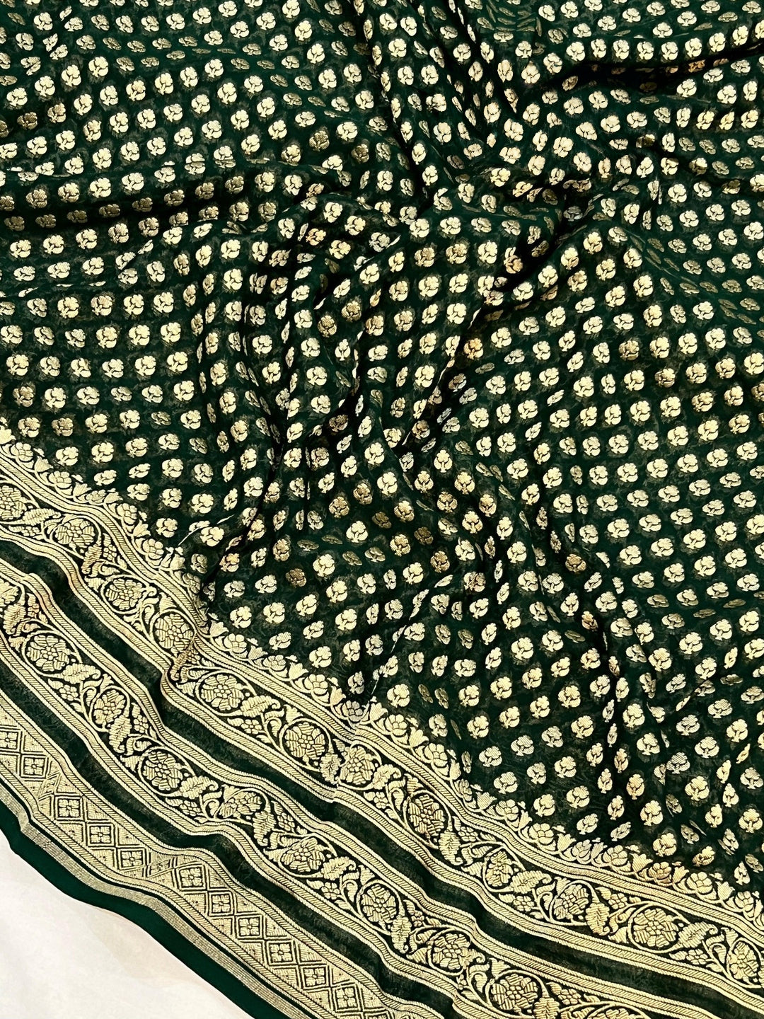 Pure georgette banarasi saree in bottle green colour with antic zari work