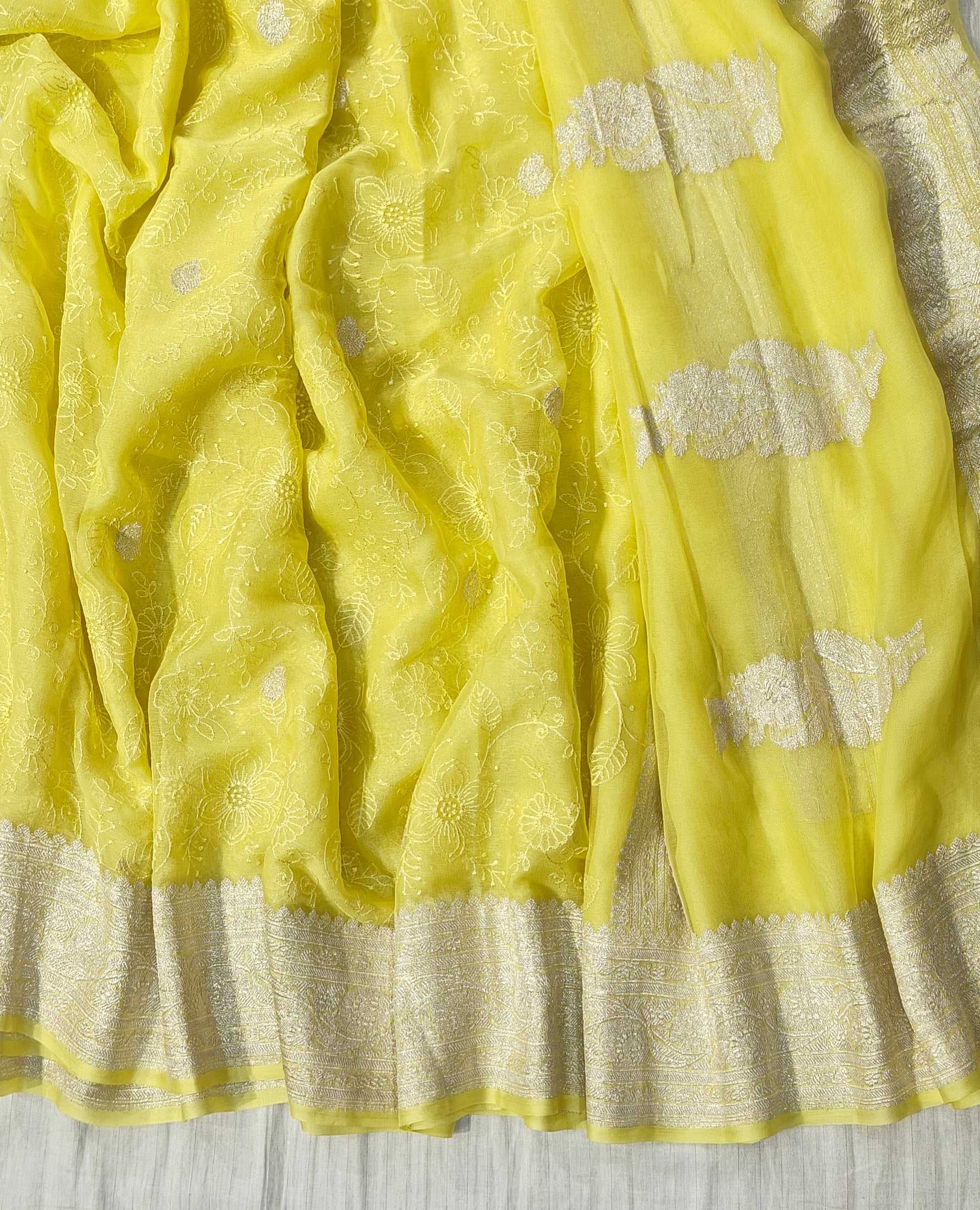 Pure khaddi chiffon saree in lemon yellow colour with all over chickenkari work
