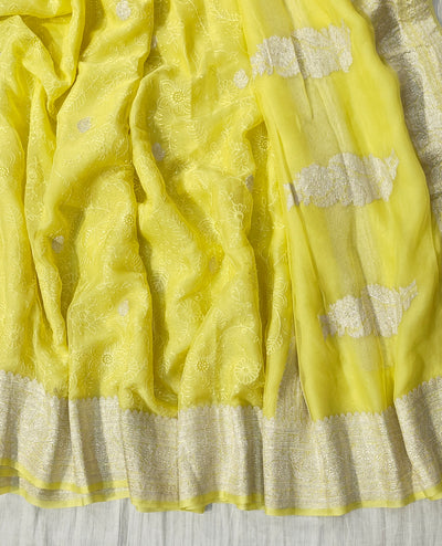 Pure khaddi chiffon saree in lemon yellow colour with all over chickenkari work