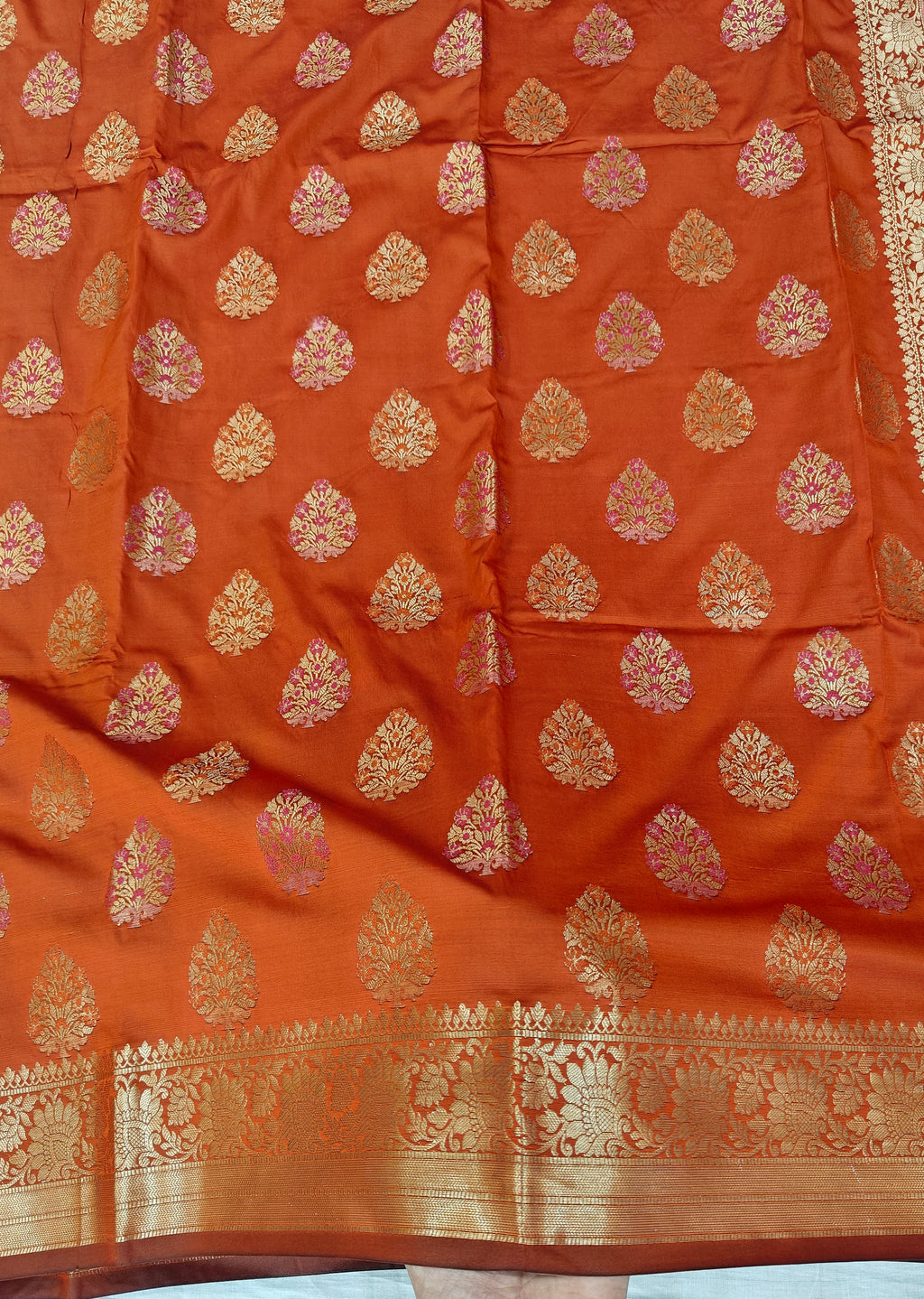 Banarasi katan by katan silk saree in orange colour with multiple meenakari work