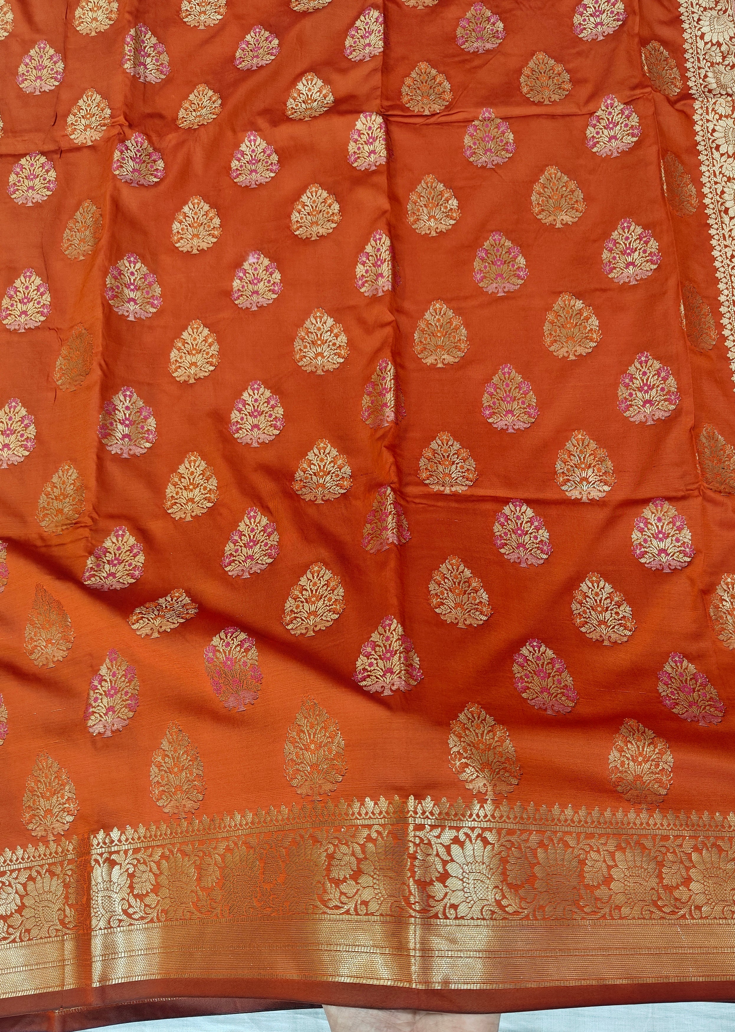 Banarasi katan by katan silk saree in orange colour with multiple meenakari work