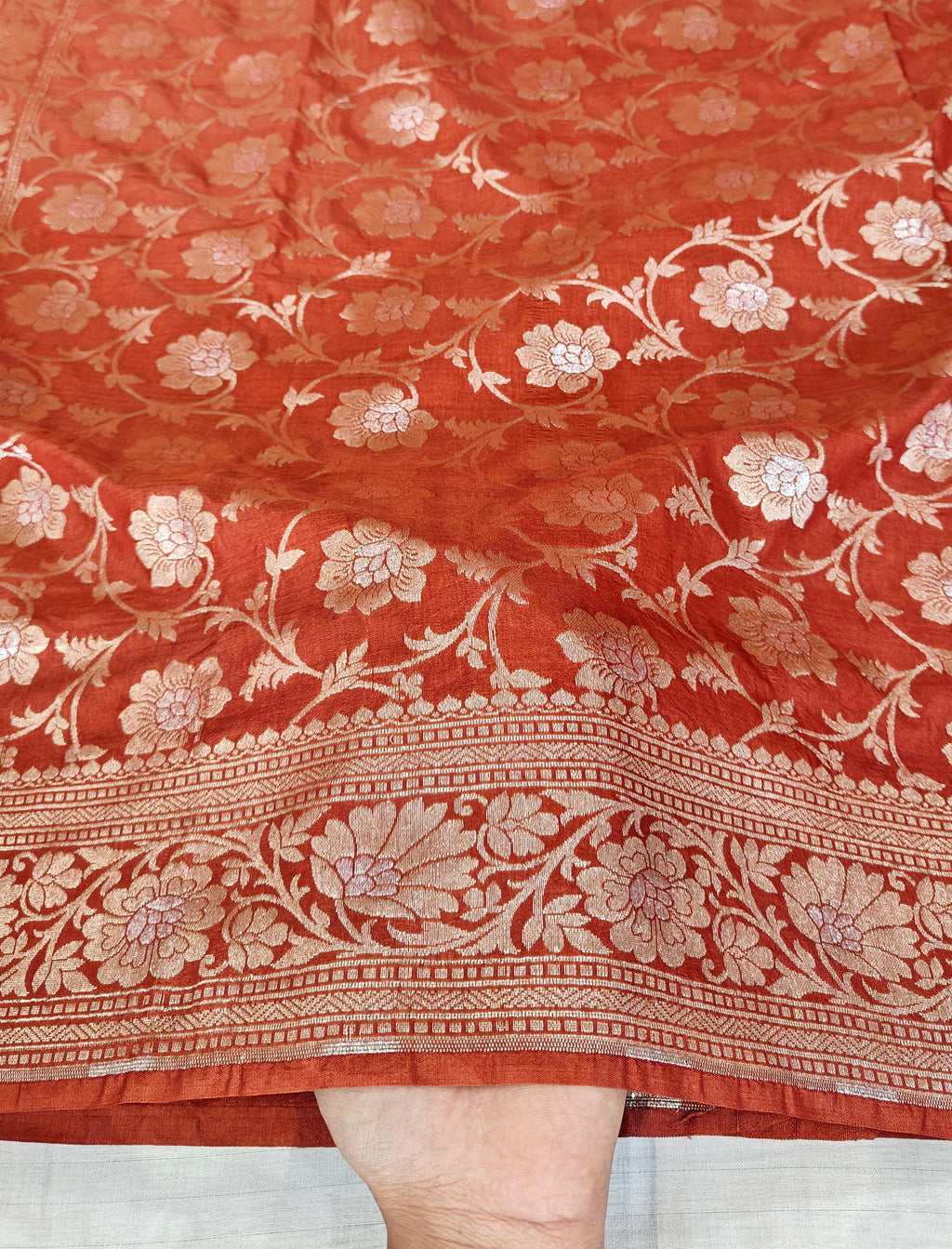 Banarasi georgette silk saree in rust orange colour with sonarupa detailing