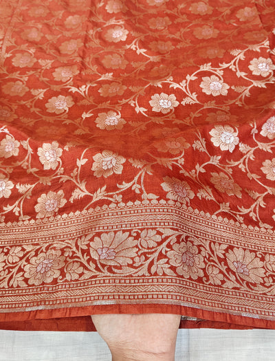 Banarasi georgette silk saree in rust orange colour with sonarupa detailing