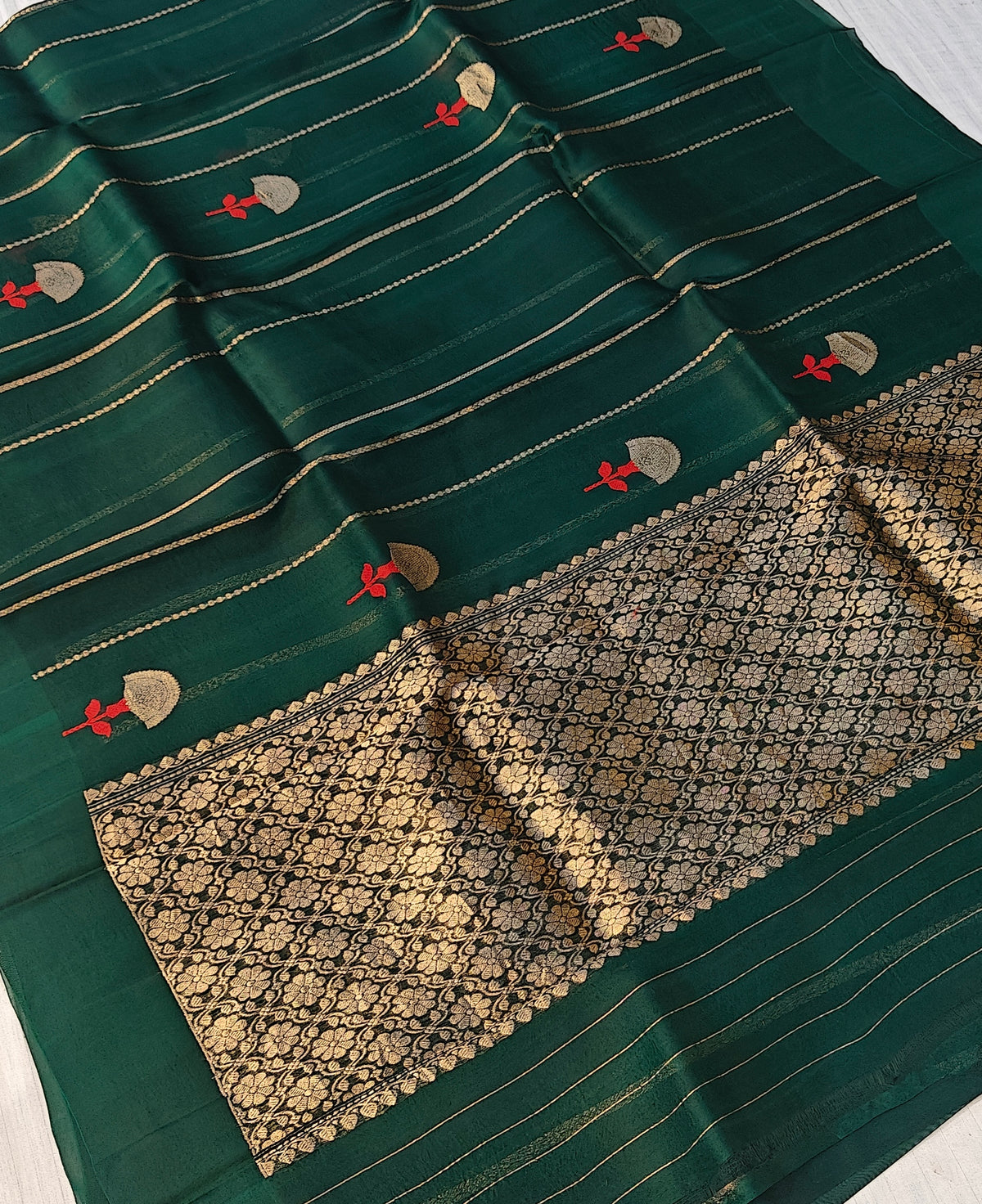 Pure handloom kora silk saree in stripes design with meenakari work in bottle green colour