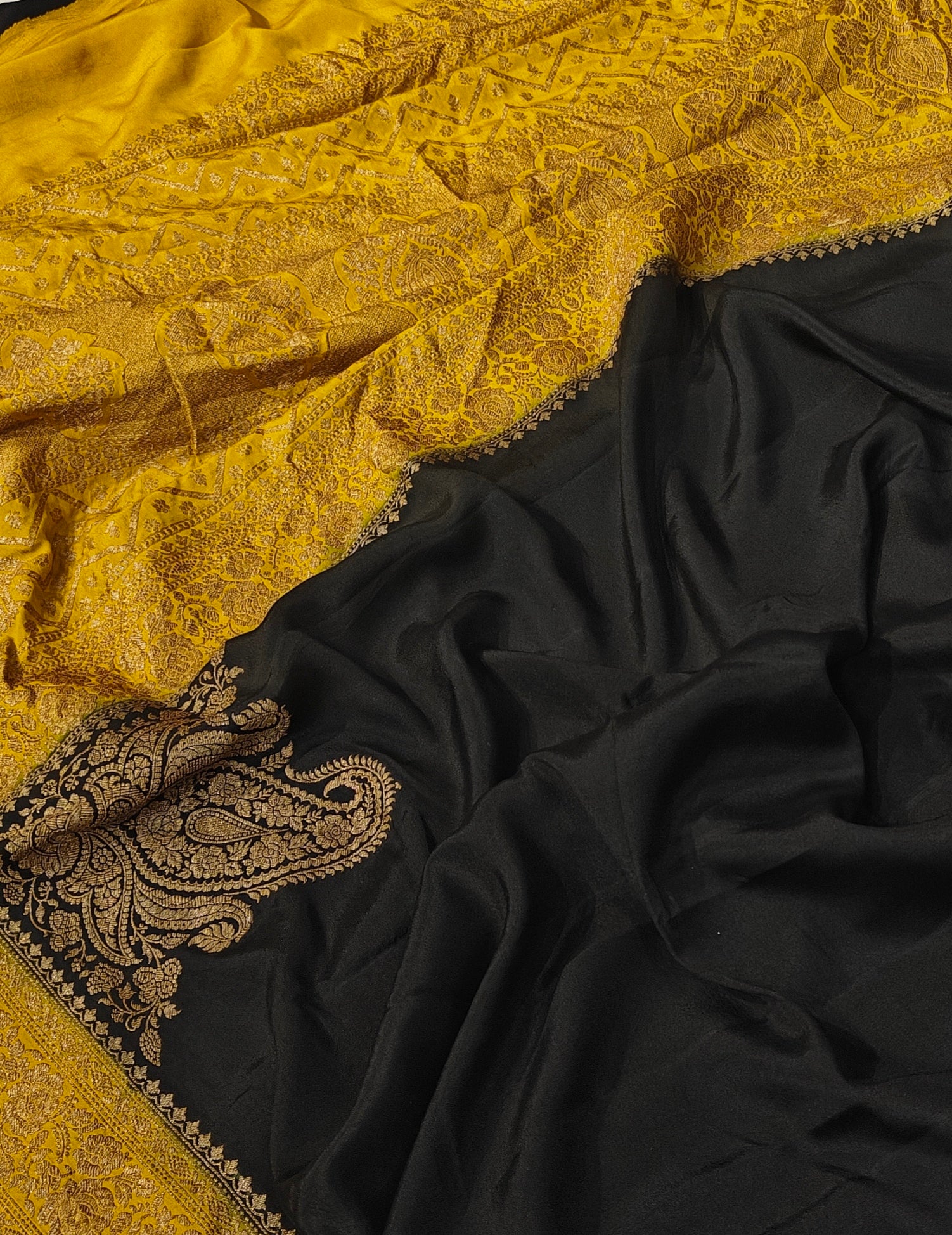 Pure khaddi crepe silk saree in black and mustard colour combination with pure antic zari work