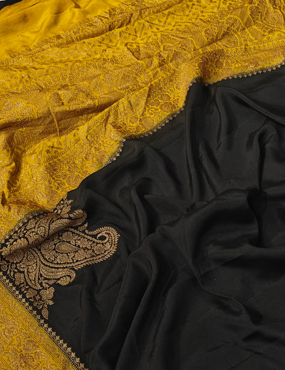 Pure khaddi crepe silk saree in black and mustard colour combination with pure antic zari work