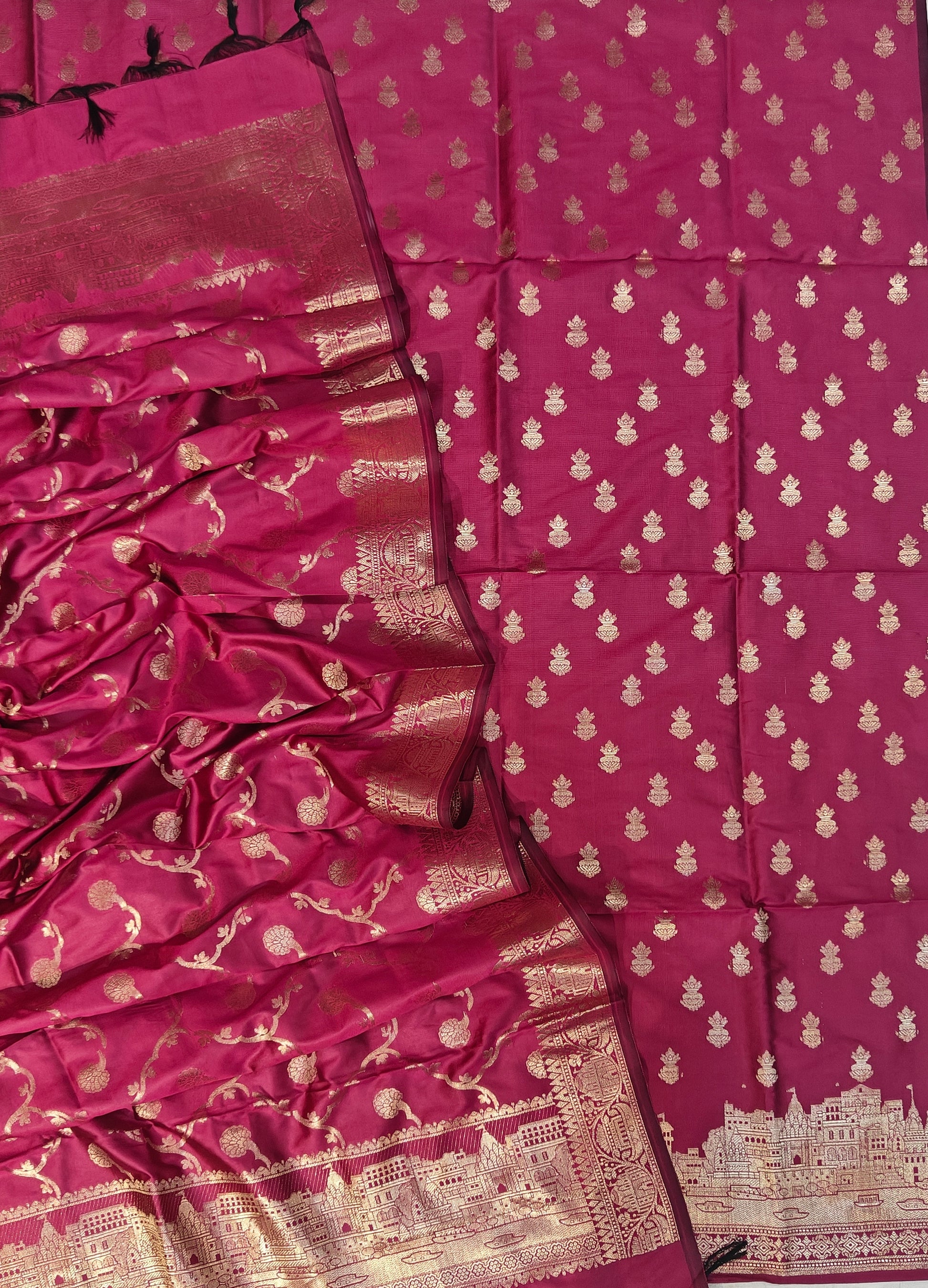 Banarasi soft silk suit in rani colour with temple design work