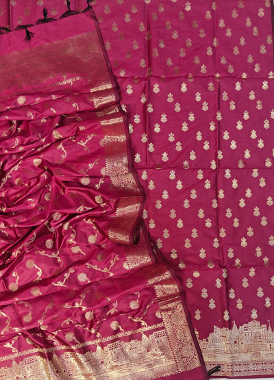 Banarasi soft silk suit in rani colour with temple design work