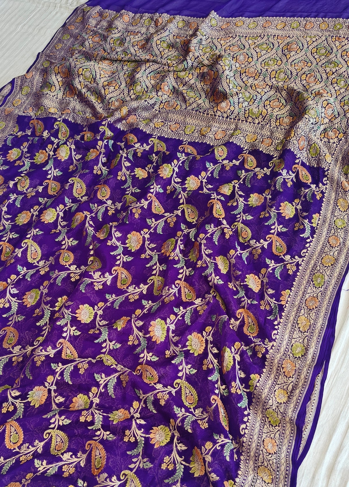 Pure georgette banarasi saree in purple colour with handbrush paint work