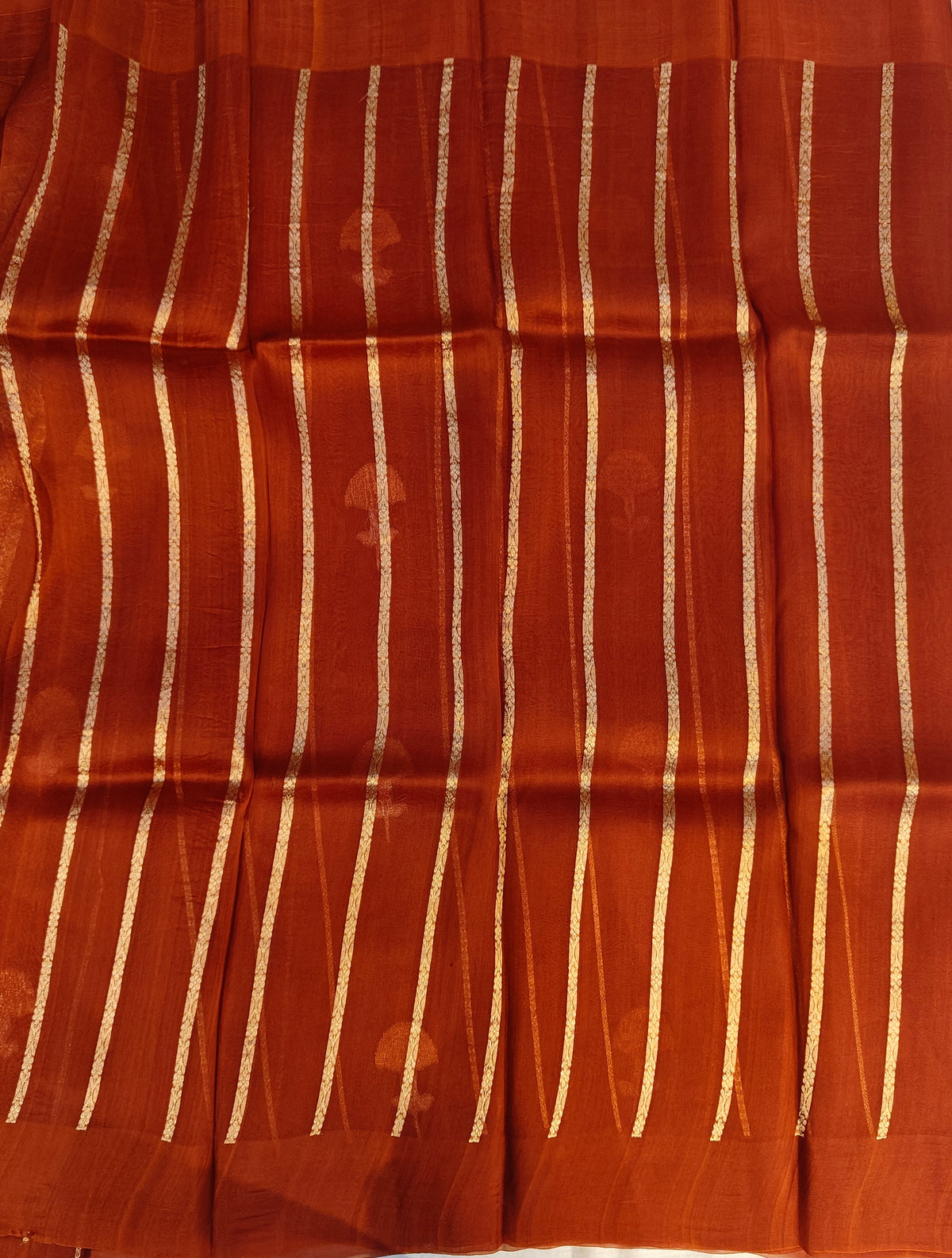 Pure handloom kora silk saree in stripes design with meenakari work in rust orange colour